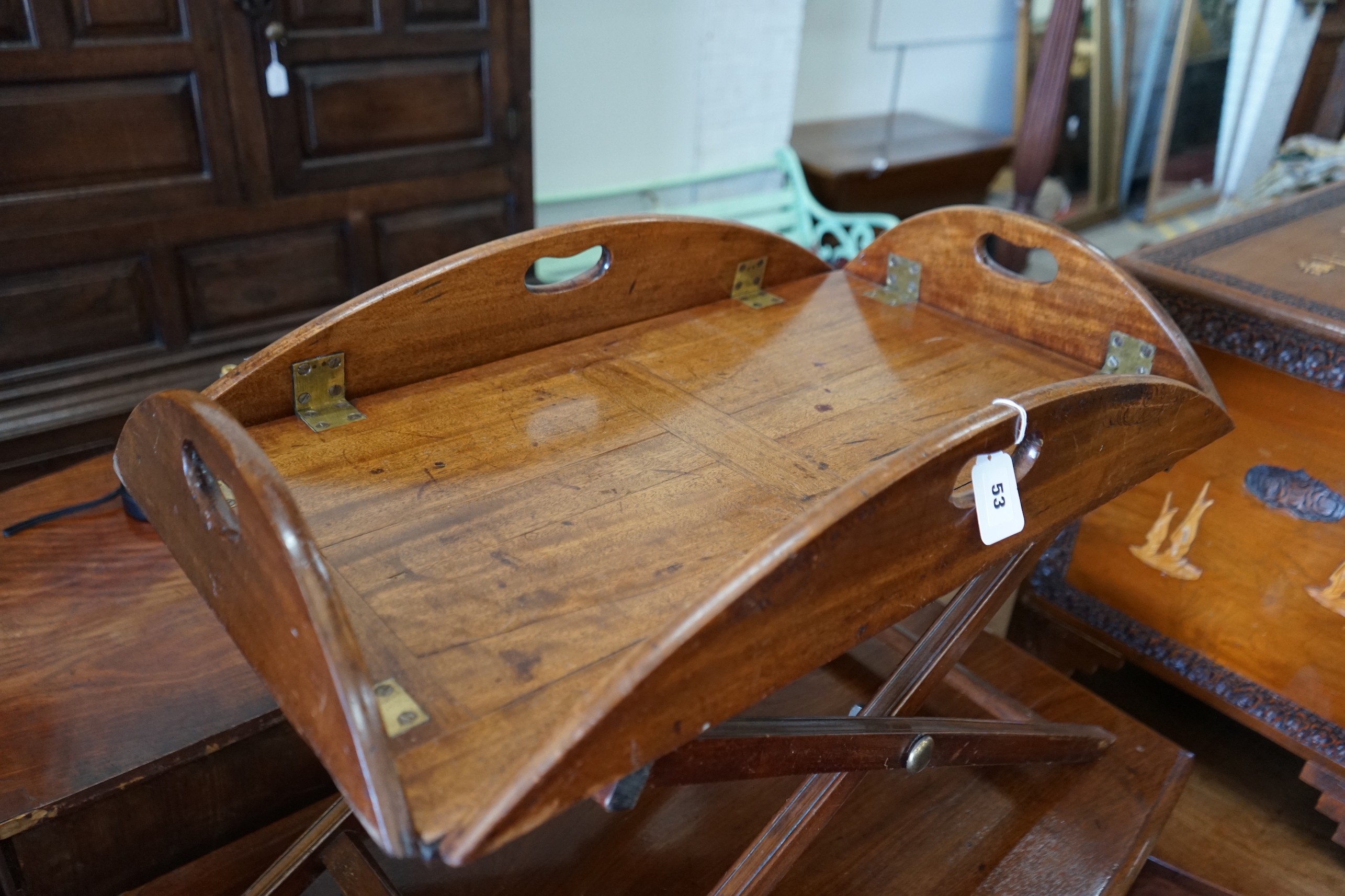 A Victorian mahogany folding butler’s tray, width 91cm, depth 63cm, height 41cm on later stand